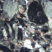 Practical 1: GP-11 GP-11. Valdness Sparagmite (Late Precambrian), Norway. Note the contrast in internal deformation between feldspar (top) and quartz (centre left), and also the...