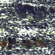 Practical 3: LH98-3 LH98-3, Moine Thrust zone, Eriboll. Crossed polars, width 0.8 mm. Fractured porphyroclasts of tourmaline (below) and feldspar (above) in dynamically...